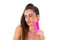 Young woman holding pink hair brush Royalty Free Stock Photo