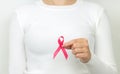 Young woman holding pink ribbon breast cancer awareness Royalty Free Stock Photo