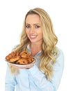 Young Woman Holding a Plate of Mixed Danish Pastries Royalty Free Stock Photo
