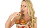 Young Woman Holding a Plate of mixed Danish Pastries Royalty Free Stock Photo