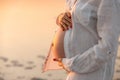 Young woman holding pregnant belly in hands Royalty Free Stock Photo