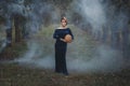 Young woman holding a pumpkin