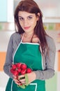 Young woman holding radishes