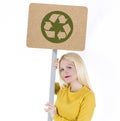 Young woman holding recycle banner