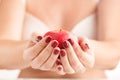 Young woman holding red apple in hand. Girl with red apple in ha Royalty Free Stock Photo