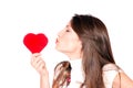 Young woman holding a red heart