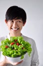 Young Woman Holding Salad Bowl Looking Beside Royalty Free Stock Photo