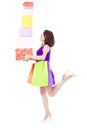 Young woman holding shopping bag and gift boxes over white Royalty Free Stock Photo