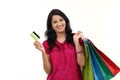 Young woman holding shopping bags and credit card Royalty Free Stock Photo