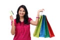 Young woman holding shopping bags and credit card Royalty Free Stock Photo