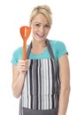 Young Woman Holding a Slotted Serving Spoon Royalty Free Stock Photo