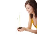 Young woman holding small plant and soil Royalty Free Stock Photo