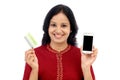 Young woman holding smart phone and credit card Royalty Free Stock Photo