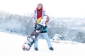 Young woman holding snowboard on her shoulders Royalty Free Stock Photo