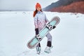 Young woman holding snowboard Royalty Free Stock Photo