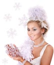 Young woman holding snowflake.