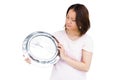 Young woman holding stainless steel clock