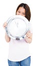 Young woman holding stainless steel clock