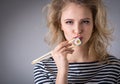 Young woman holding sushi rolls