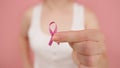 Young woman holding symbolic pink ribbon. Breast cancer awareness month, pink october Royalty Free Stock Photo