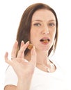 Young woman holding typical Dutch candy pepernoten isolated