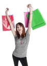 Young Woman Holding Up Colorful Shopping Bags Royalty Free Stock Photo
