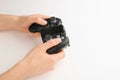 Young woman holding video game controller on white background Royalty Free Stock Photo