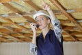 young woman holding walkie talkie indoors