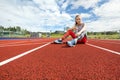 Young Woman Holding Water Bottle On Running Tracks Royalty Free Stock Photo