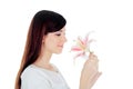 Young woman holding a white lily at face isolated over Royalty Free Stock Photo