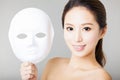 Young woman holding white mask Royalty Free Stock Photo