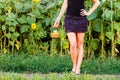 Young woman holding a wicker basket with a jug of sunflower oil Royalty Free Stock Photo