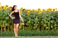 Young woman holding a wicker basket with a jug of sunflower oil Royalty Free Stock Photo