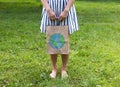 a young woman holds an eco-package in her hands Royalty Free Stock Photo