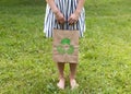 a young woman holds an eco-package in her hands Royalty Free Stock Photo