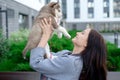 Young women holds her best friend little pet puppy of husky in her arms. love for dogs Royalty Free Stock Photo