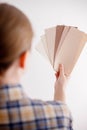 Young woman holds in her hand color paint samples for the wall. Royalty Free Stock Photo