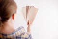 Young woman holds in her hand color paint samples for the wall. Royalty Free Stock Photo