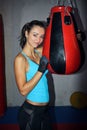 Young woman holding a punch ball at the gym Royalty Free Stock Photo