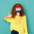 Young woman with Holland flag painted on her face