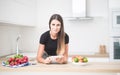 Young woman in home kitchen with tablet Royalty Free Stock Photo