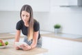 Young woman in home kitchen with tablet Royalty Free Stock Photo