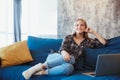 Young woman at home in the living room resting on coach Royalty Free Stock Photo