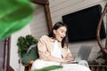 Young woman at home looking at her laptop with amazed, wow face, shocked with announcement notification on computer Royalty Free Stock Photo