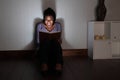 Young woman at home screams reading spooky book Royalty Free Stock Photo