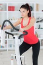 Young woman at home on stepper machine