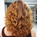 young woman with honey blonde hair in wavy styling in beauty salon