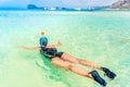 Young woman in honeymoon with snorkeling mask dive underwater with tropical fishes in coral reef sea pool. Royalty Free Stock Photo