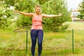 Young woman with hoola hoop outdoors Royalty Free Stock Photo