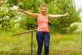 Young woman with hoola hoop outdoors Royalty Free Stock Photo